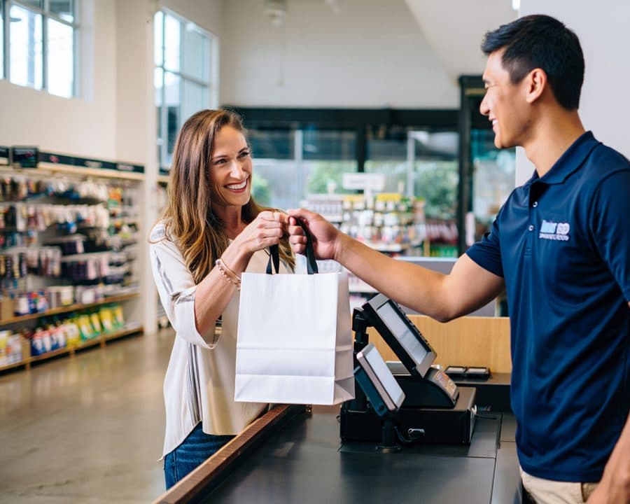 Retail checkout with loyalty and WhatsApp follow-up